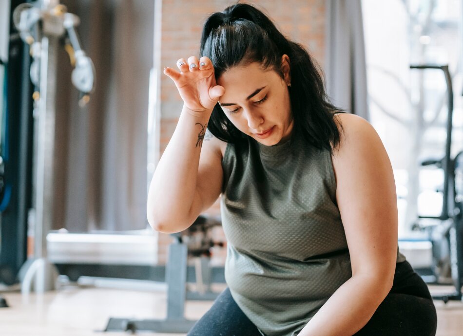 Tired woman at gym