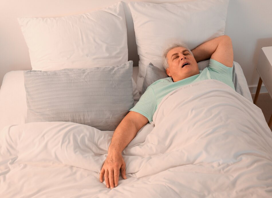 Man sleeping on back with his mouth open